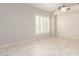 Neutral living room with tiled flooring and one window with white shutter coverings at 4801 E Quien Sabe Way, Cave Creek, AZ 85331