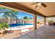 Backyard pool with rock waterfall feature, grill and patio area, perfect for outdoor fun at 4801 E Quien Sabe Way, Cave Creek, AZ 85331