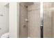 Shower stall with tile and glass door. Toilet is to the left of the shower at 4808 N 24Th St # 702, Phoenix, AZ 85016