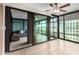 A sunroom is visible from the living room, as well as floor to ceiling windows and a ceiling fan at 4808 N 24Th St # 702, Phoenix, AZ 85016