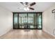 The living room leads into a sunroom, which is visible through large sliding glass doors at 4808 N 24Th St # 702, Phoenix, AZ 85016