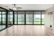 Bright living room with lots of natural light from the floor to ceiling windows, plus a ceiling fan at 4808 N 24Th St # 702, Phoenix, AZ 85016