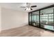 The living room leads into a sunroom, which is visible through large sliding glass doors at 4808 N 24Th St # 702, Phoenix, AZ 85016