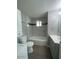 This is a bathroom with a combination tub and shower, gray tiling, and updated fixtures at 500 N 67 Ave # 149, Phoenix, AZ 85043