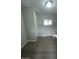 Cozy bedroom with neutral paint, vinyl floors, and natural light from a window at 500 N 67 Ave # 149, Phoenix, AZ 85043