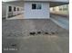 This property features a covered parking area, gravel landscaping, and a clean, modern exterior at 500 N 67 Ave # 149, Phoenix, AZ 85043