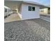 This property features a covered parking area, gravel landscaping, and a clean, modern exterior design at 500 N 67 Ave # 149, Phoenix, AZ 85043