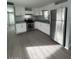 Modern kitchen featuring new stainless steel appliances, white cabinets, and neutral countertops at 500 N 67 Ave # 149, Phoenix, AZ 85043
