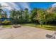 Backyard has a beautiful lawn, a patio, mature trees and a firepit at 505 W Howe St, Tempe, AZ 85281
