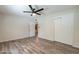 Bright bedroom features hardwood floors, ceiling fan, and closet with sliding doors at 505 W Howe St, Tempe, AZ 85281