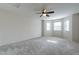 Spacious bedroom boasts carpet, ceiling fan and bay windows at 505 W Howe St, Tempe, AZ 85281