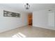 Neutral dining area offers tile floors, an ornate light fixture, and a stained glass window at 505 W Howe St, Tempe, AZ 85281