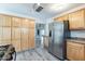 A spacious kitchen with hardwood-style floors features a refrigerator and wood cabinets at 505 W Howe St, Tempe, AZ 85281