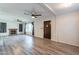 This spacious living room features hardwood-style floors, a fireplace, and natural light at 505 W Howe St, Tempe, AZ 85281