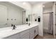 Clean bathroom with double sinks, matte black fixtures, and a shower/tub combo at 5460 S Dillon Cir, Mesa, AZ 85212