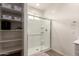 Bathroom featuring open shelves, a glass shower and natural light from the window at 5460 S Dillon Cir, Mesa, AZ 85212