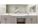 Bathroom featuring double sinks, a vanity, and lots of cabinets for storage at 5460 S Dillon Cir, Mesa, AZ 85212