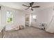A cozy bedroom with two chairs, a ceiling fan and natural light from its two windows at 5460 S Dillon Cir, Mesa, AZ 85212