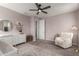 Cozy Bedroom with a chair, dresser, and decorative shelving at 5460 S Dillon Cir, Mesa, AZ 85212