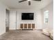A comfy bedroom featuring a ceiling fan, bright lighting and a modern entertainment center at 5460 S Dillon Cir, Mesa, AZ 85212