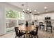 Eat in kitchen area featuring wood table, access to backyard and kitchen at 5460 S Dillon Cir, Mesa, AZ 85212