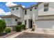 Beautiful two-story townhome with manicured landscaping and a two-car garage at 5460 S Dillon Cir, Mesa, AZ 85212