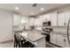 Bright kitchen featuring white cabinets, stainless steel appliances, and a center island at 5460 S Dillon Cir, Mesa, AZ 85212