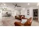 Inviting living room open to dining area and featuring wood floors and neutral color palette at 5460 S Dillon Cir, Mesa, AZ 85212