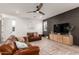 Comfortable living room featuring gray accent wall, hardwood floors, and neutral walls at 5460 S Dillon Cir, Mesa, AZ 85212