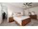 Bedroom with ceiling fan, natural light, neutral color palette, and a ensuite bathroom at 5460 S Dillon Cir, Mesa, AZ 85212