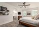 Bright bedroom with a ceiling fan, a walk in closet, and an en suite bathroom at 5460 S Dillon Cir, Mesa, AZ 85212