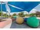Playground featuring vibrant play mounds and shaded play areas for community enjoyment at 5460 S Dillon Cir, Mesa, AZ 85212