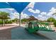 Community park with a see-saw and shaded areas for relaxing on a sunny day at 5460 S Dillon Cir, Mesa, AZ 85212