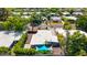 Aerial view of a home with lush landscaping and a vibrant turquoise sun shade at 5739 N 11Th St, Phoenix, AZ 85014