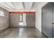 Spacious bedroom with concrete floors, exposed brick wall, and window with curtains at 5739 N 11Th St, Phoenix, AZ 85014