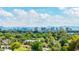 Expansive city skyline view with lush trees, mountains, and clear blue sky with scattered clouds at 5739 N 11Th St, Phoenix, AZ 85014