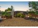Charming single-story home featuring desert landscaping, unique rusted steel accents, and a neutral color scheme at 5739 N 11Th St, Phoenix, AZ 85014