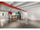 Open floor plan boasts modern kitchen with stainless steel appliances and concrete floors at 5739 N 11Th St, Phoenix, AZ 85014