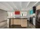 Modern kitchen with island, sleek white countertops and stainless steel appliances at 5739 N 11Th St, Phoenix, AZ 85014