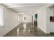 Bright living room features polished concrete floors, exposed beams, and seamless flow to the kitchen at 5739 N 11Th St, Phoenix, AZ 85014