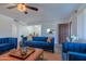 Inviting living room with plush blue seating and modern décor at 6044 W Augusta Ave, Glendale, AZ 85301