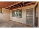 Covered patio with tile flooring, string lights, welcome mat, and gated door at 6044 W Augusta Ave, Glendale, AZ 85301