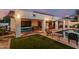 Backyard with patio, outdoor furniture, in ground pool, and artificial turf at 6133 E Saddleback St, Mesa, AZ 85215