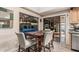 Bright breakfast nook featuring a dining table, chairs, and access to an outdoor patio at 6133 E Saddleback St, Mesa, AZ 85215