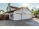 Exterior of the garage, featuring a white exterior and terra cotta tiled roof at 6133 E Saddleback St, Mesa, AZ 85215