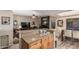 Open-concept living room with granite countertops, fireplace, hardwood floors, and modern decor at 6133 E Saddleback St, Mesa, AZ 85215