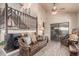Open-concept living room with wood floors and staircase at 6133 E Saddleback St, Mesa, AZ 85215