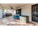 Outdoor covered patio with hot tub, storage, ceiling fan and exterior access at 6133 E Saddleback St, Mesa, AZ 85215