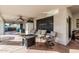 Large covered patio with ceiling fans, outdoor seating, fire pit, and mini fridge at 6133 E Saddleback St, Mesa, AZ 85215