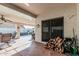 Spacious covered patio with stamped concrete, ceiling fan, and outdoor seating at 6133 E Saddleback St, Mesa, AZ 85215